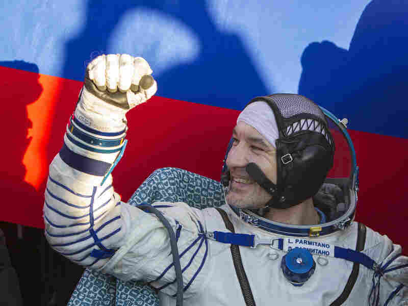 Italian astronaut Luca Parmitano gestures after landing in a remote area near the town of Zhezkazgan in central Kazakhstan on November 11, 2013.