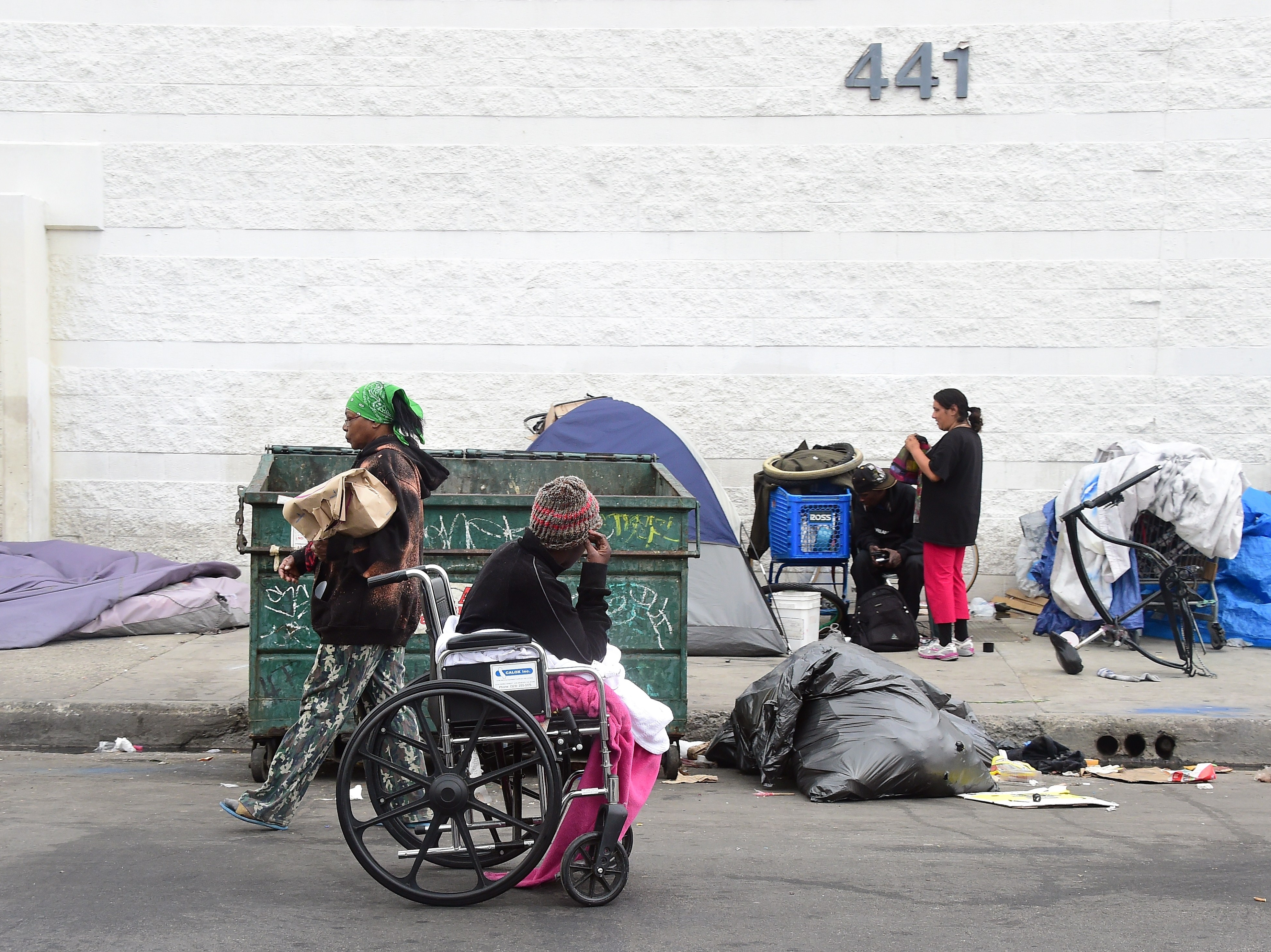 Homeless women prepare for a night spent on a street near Skid Row in Los Angeles, in May. Not every case of homelessness is so easy to spot as this, though; some groups say the Department of Housing and Urban Development numbers missed many people without stable housing.