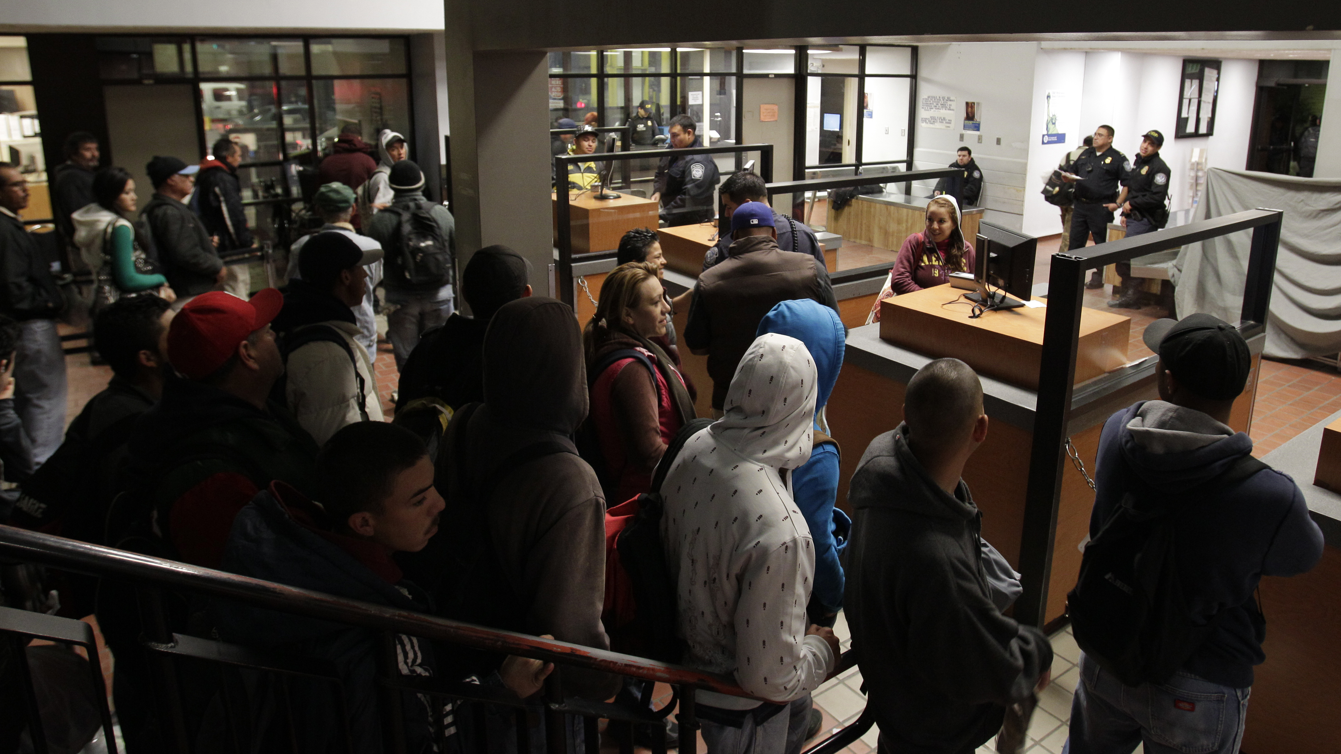 People line up to cross into the U.S. from Mexicali, Mexico in this 2012 photo. A new report finds the flow has tended to go the other way since the recession, with more Mexicans leaving the United States than arriving.