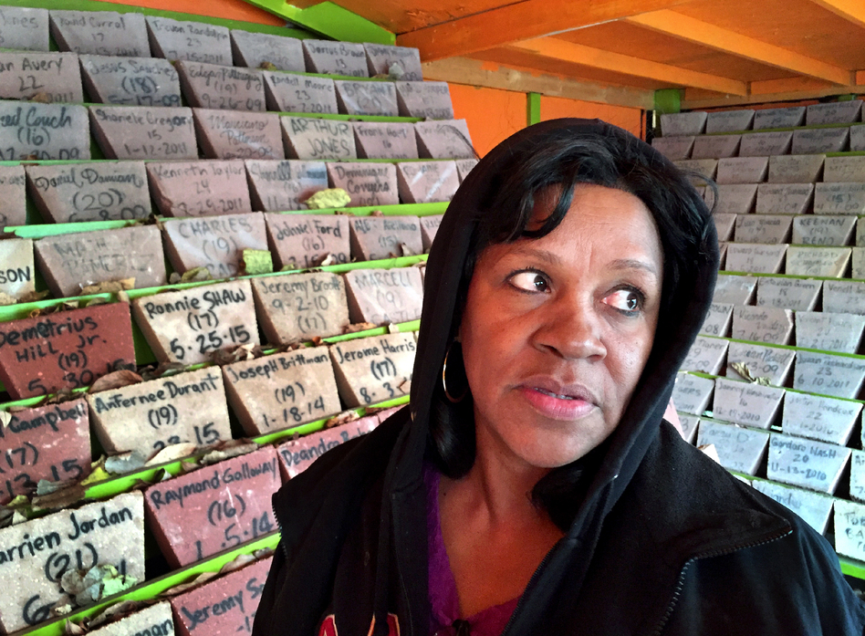 Anti-violence activist Diane Latiker stands before the memorial for young people lost to violence in Chicago over the last several years. More than 500 stones honor the victims and there are hundreds more that still need to be added. (Peter Breslow/NPR)