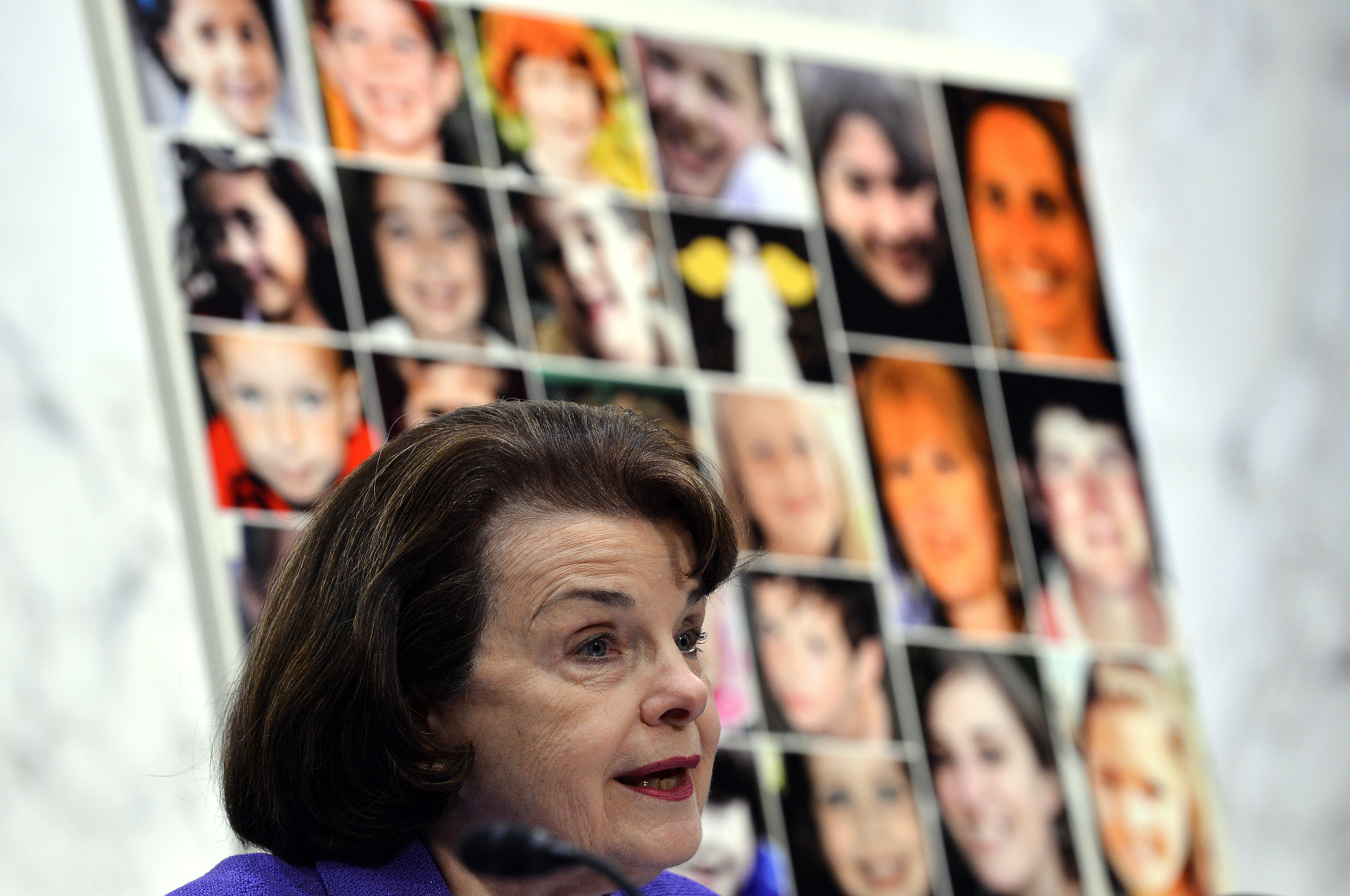 Pictures of the Sandy Hook Elementary School shooting victims are displayed as California Democratic Sen. Dianne Feinstein speaks during a 2013 Senate hearing. Wednesday's shooting in San Bernardino, which killed 14 people, was the deadliest since the 2012 shooting at Sandy Hook, which left 26 people dead.