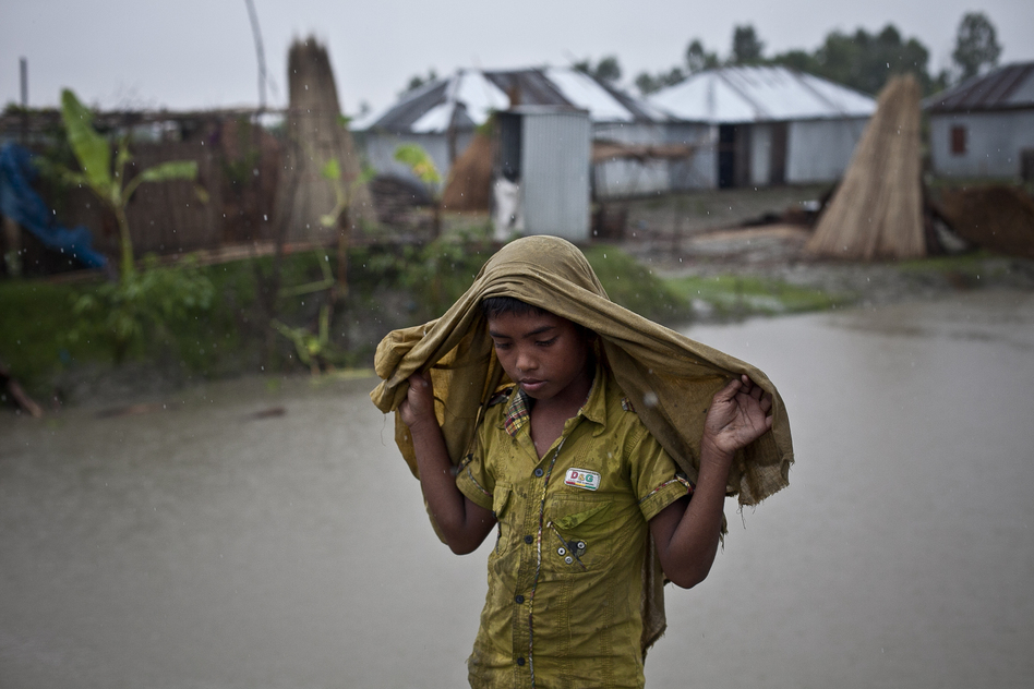 Bangladesh is facing drought, cyclones and floods. This expanse of water, photographed in September 2014, was a field the month before. It's in the Kalashuna village in Gaibandha district. (Allison Joyce/Getty Images)