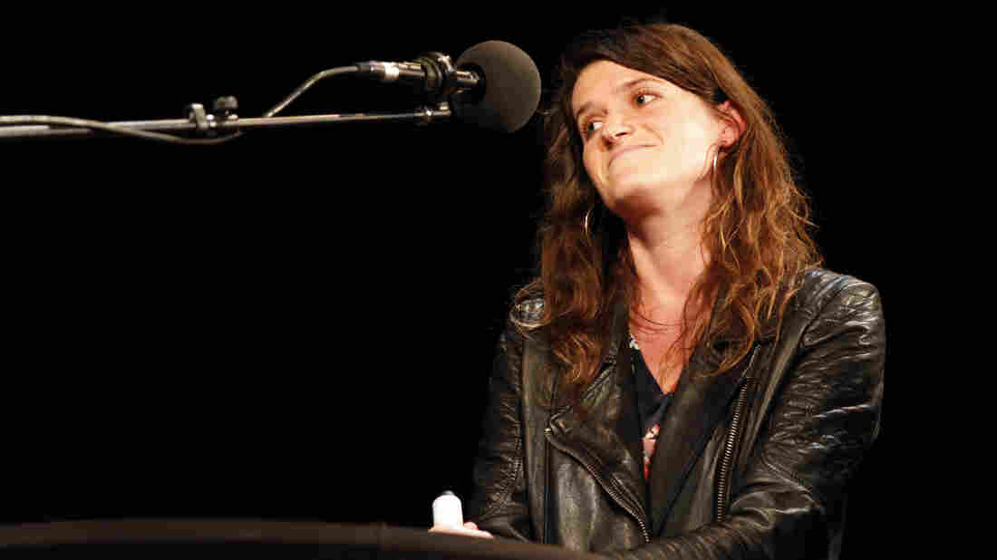 Invisibilia's Lulu Miller on stage at the Byham Theater in Pittsburgh for Ask Me Another.