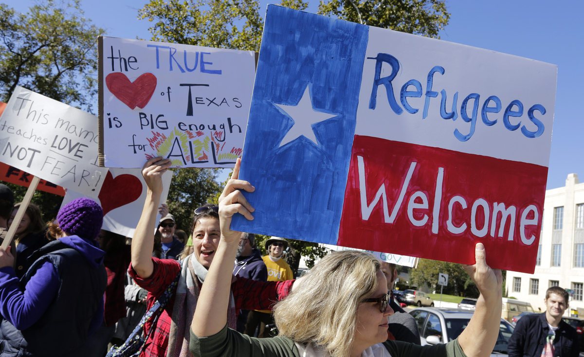 Members of The Syrian People Solidarity Group protest on Nov. 22 in Austin, Texas, after Texas Gov. Greg Abbott announced he'd refuse to allow Syrian refugees in the state. Texas and the U.S. government are now clashing in court over the issue.