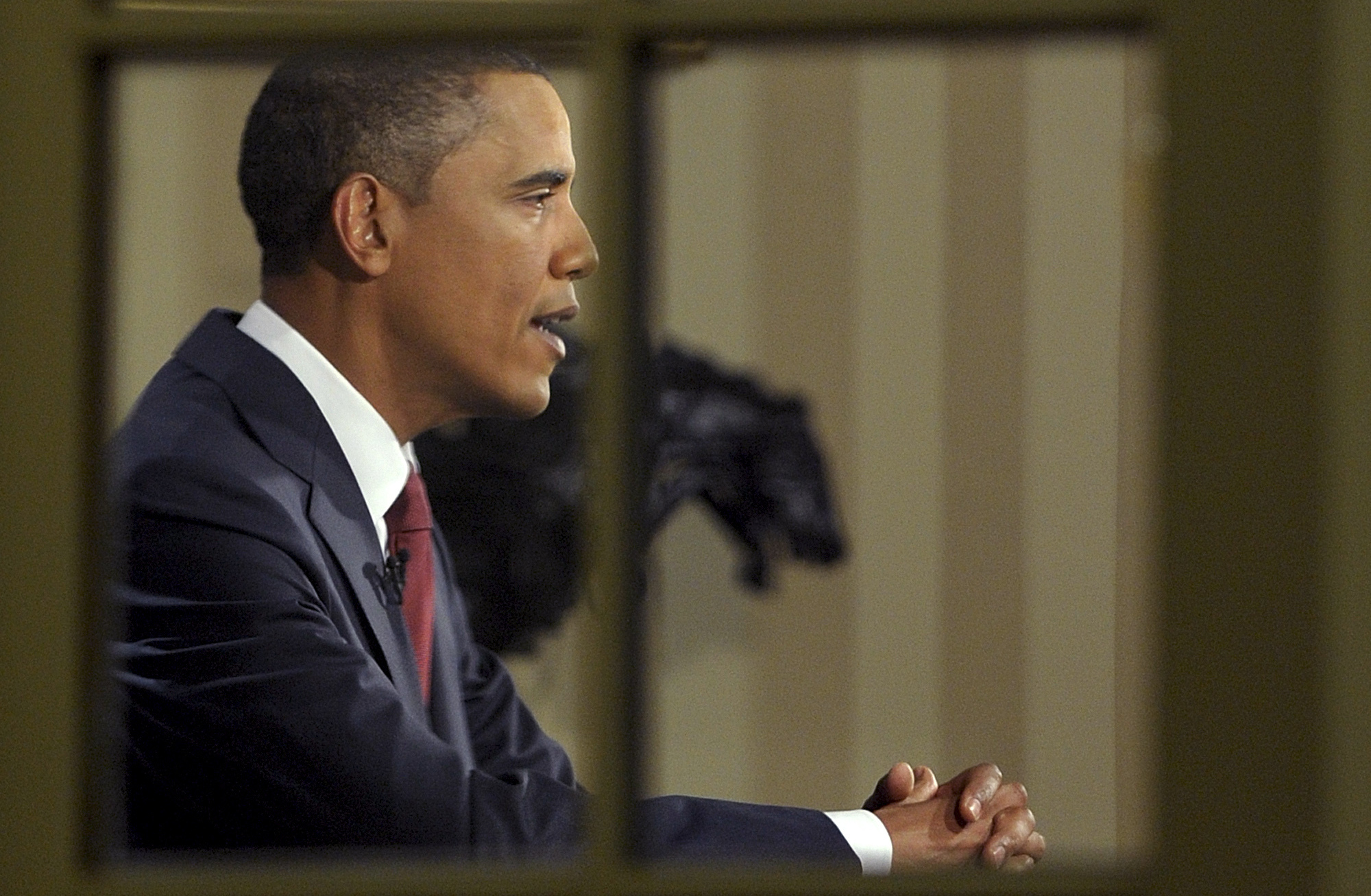 President Obama, photographed from the Rose Garden, delivers a prime-time televised address marking the the end of combat mission in Iraq from the Oval Office in 2010.