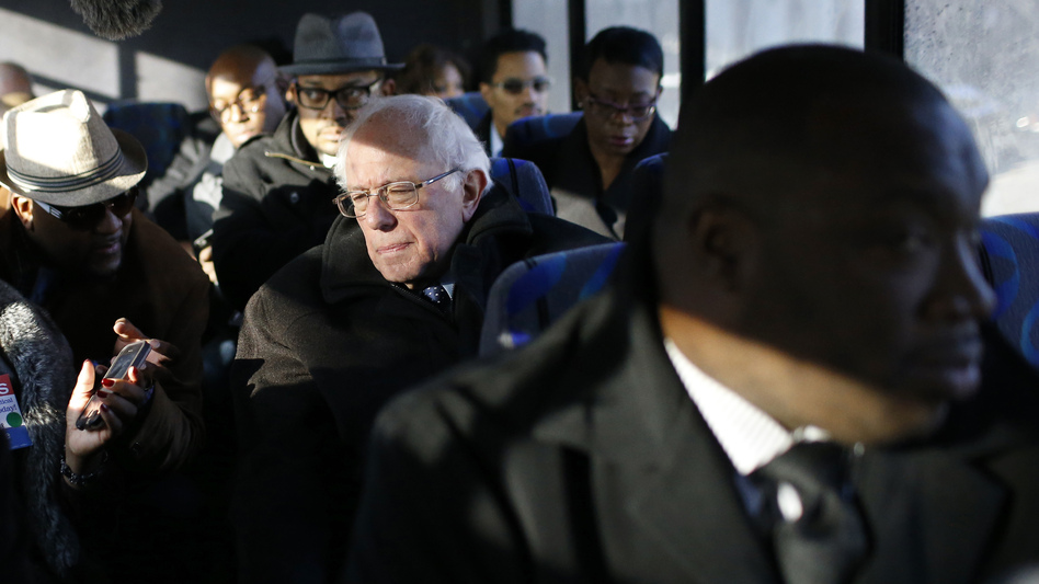 Bernie Sanders with preachers and reporters on a bus in Baltimore on Tuesday. (Patrick Semansky/AP)