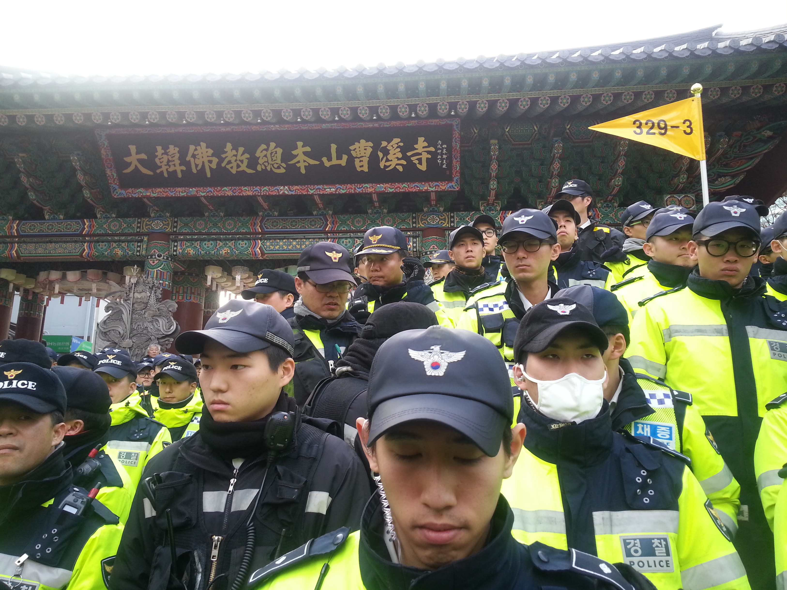 Hundreds of police officers outside Jogyesa, Seoul's top Buddhist temple, as a deadline passed for a labor leader holed up inside to turn himself in. (for NPR)