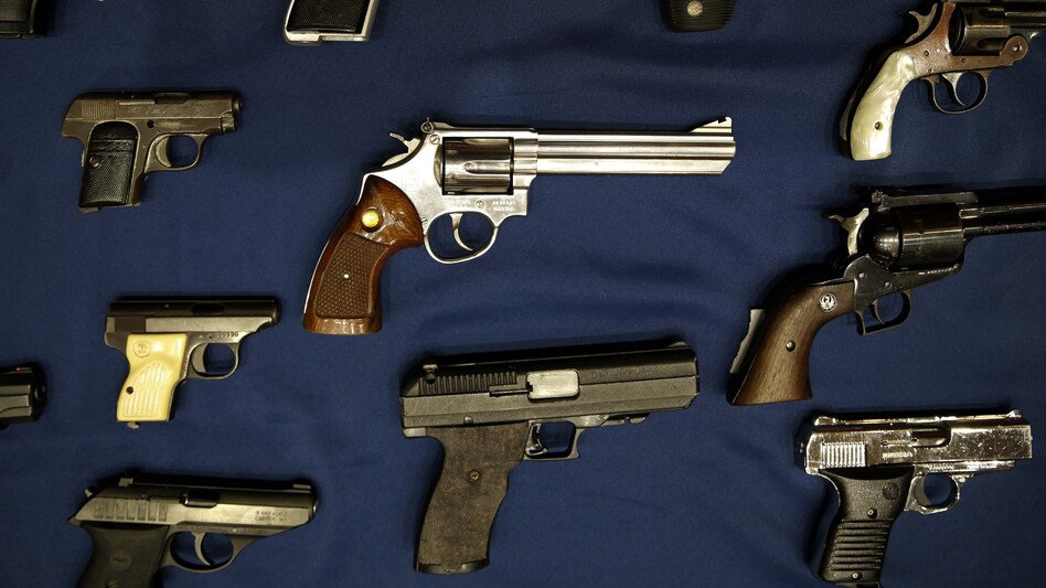 Guns seized by the police are displayed during an Oct. 2015 news conference in New York. (Seth Wenig/AP)