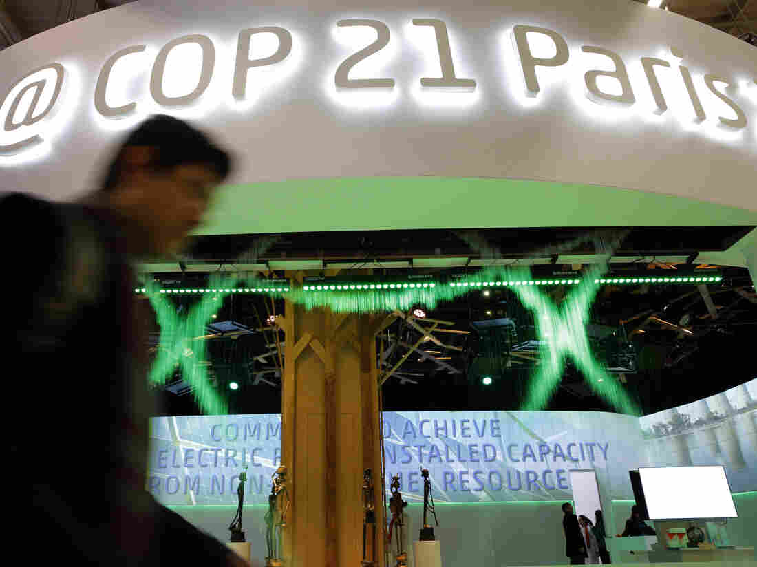 A man walks past the Indian Pavilion at the COP21, the United Nations Climate Change Conference, in Le Bourget, north of Paris, on Dec. 7.