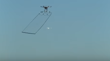 Tokyo's police drone swoops in on another drone. It is equipped with a net to entangle suspicious drones if they enter restricted airspace. (Screenshot by NPR)