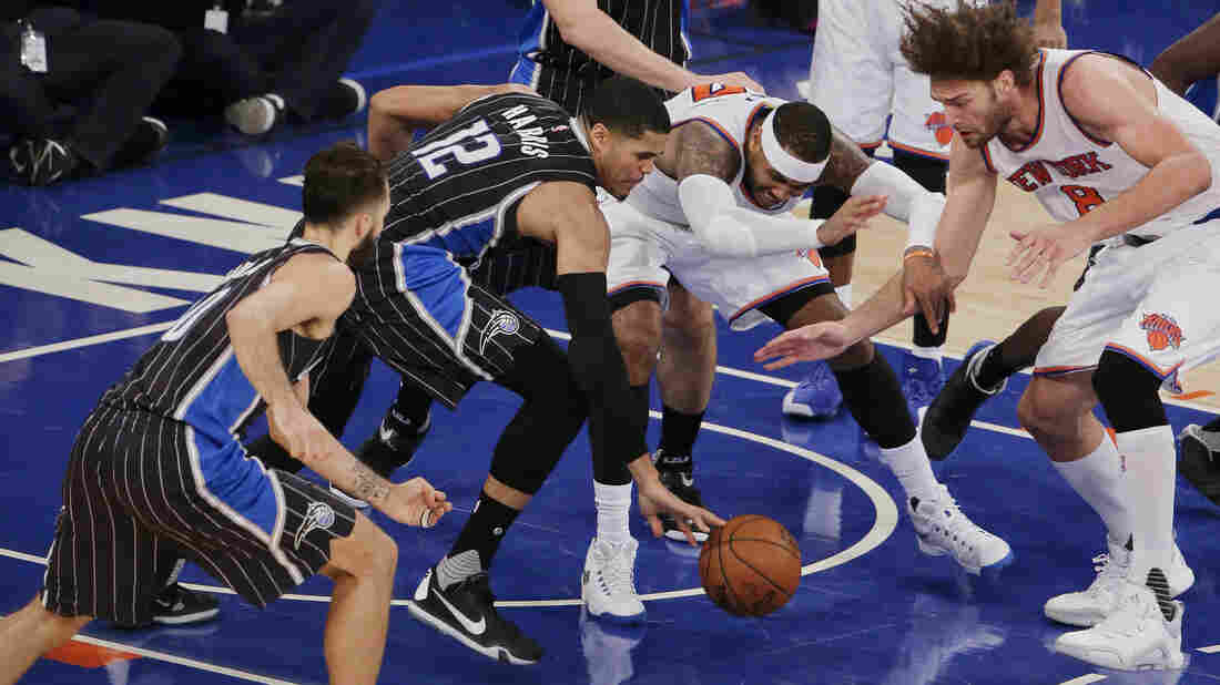 New York Knicks forward Carmelo Anthony is stripped of the ball by Orlando Magic forward Tobias Harris (second from left) as New York Knicks center Robin Lopez (far right) reaches in during the fourth quarter of their game Monday in New York.