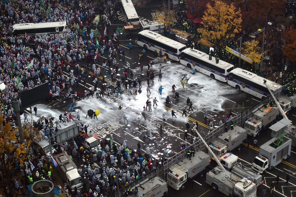 Police use water cannons to block South Korean protesters following a large rally against the government in downtown Seoul on Nov. 14. (Jung Yeon-Je/AFP/Getty Images)