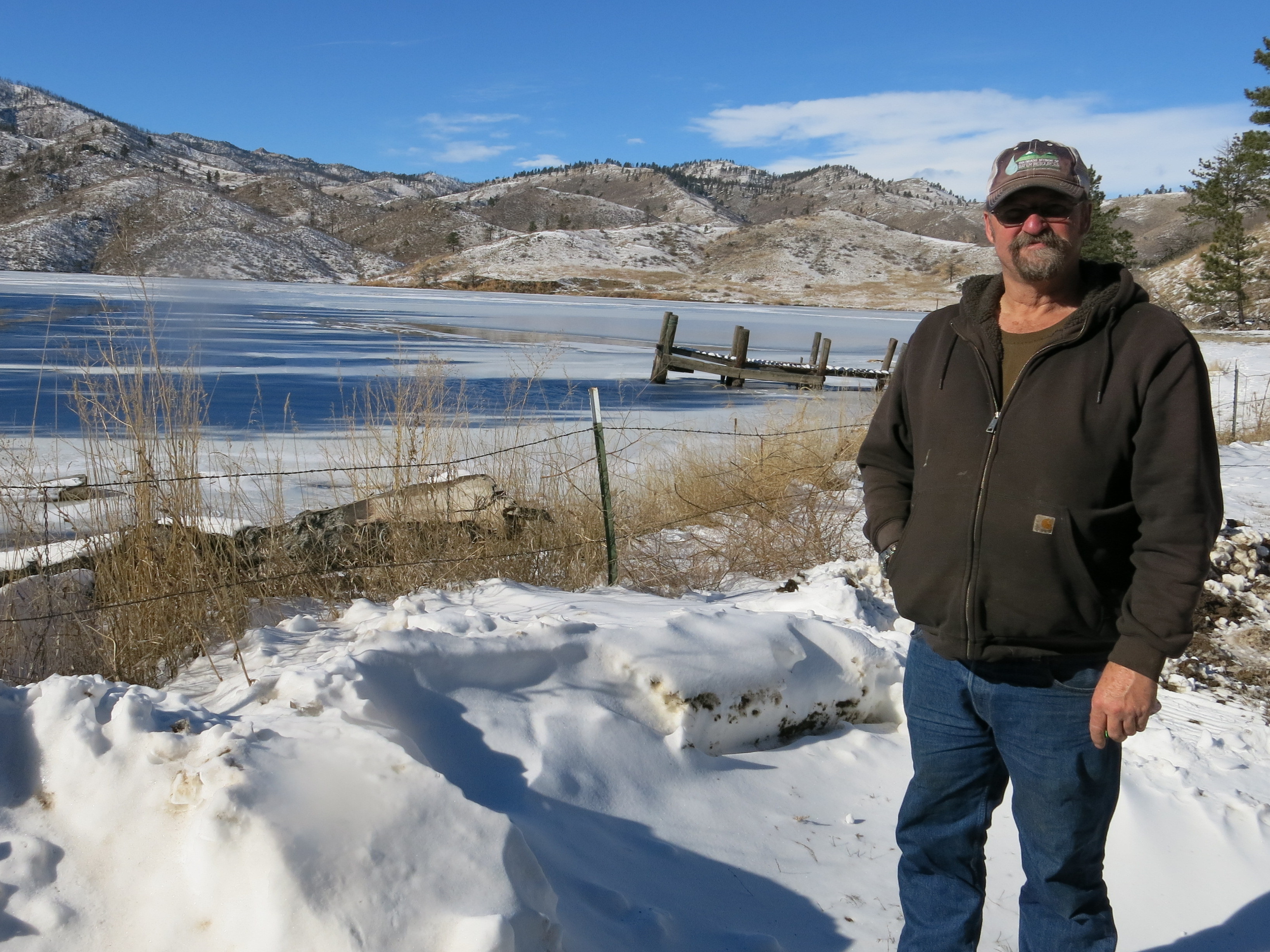 Reservoir caretaker Doug Billingsley stands in his front yard — just yards away from the Milton Seaman Reservoir north of Fort Collins.