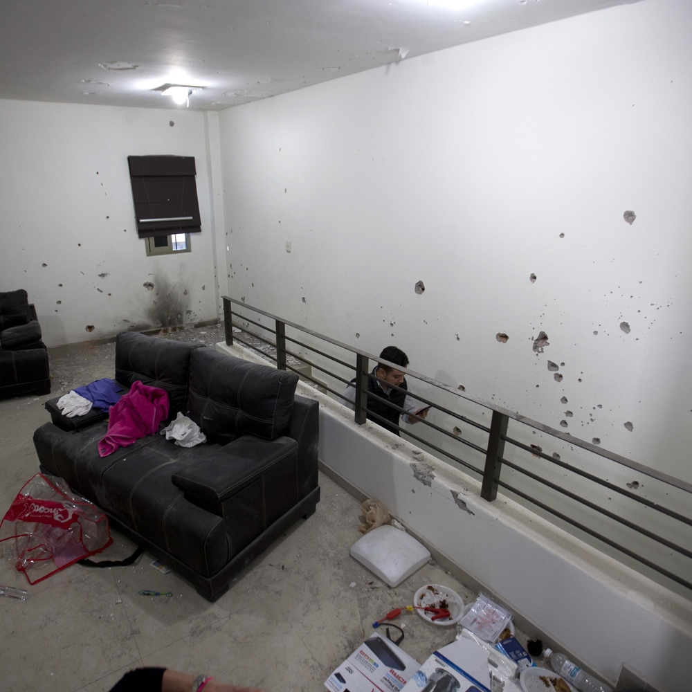 Bullet holes riddle the walls of the second floor of the home that marines raided in their search for the Mexican drug lord Joaquin 