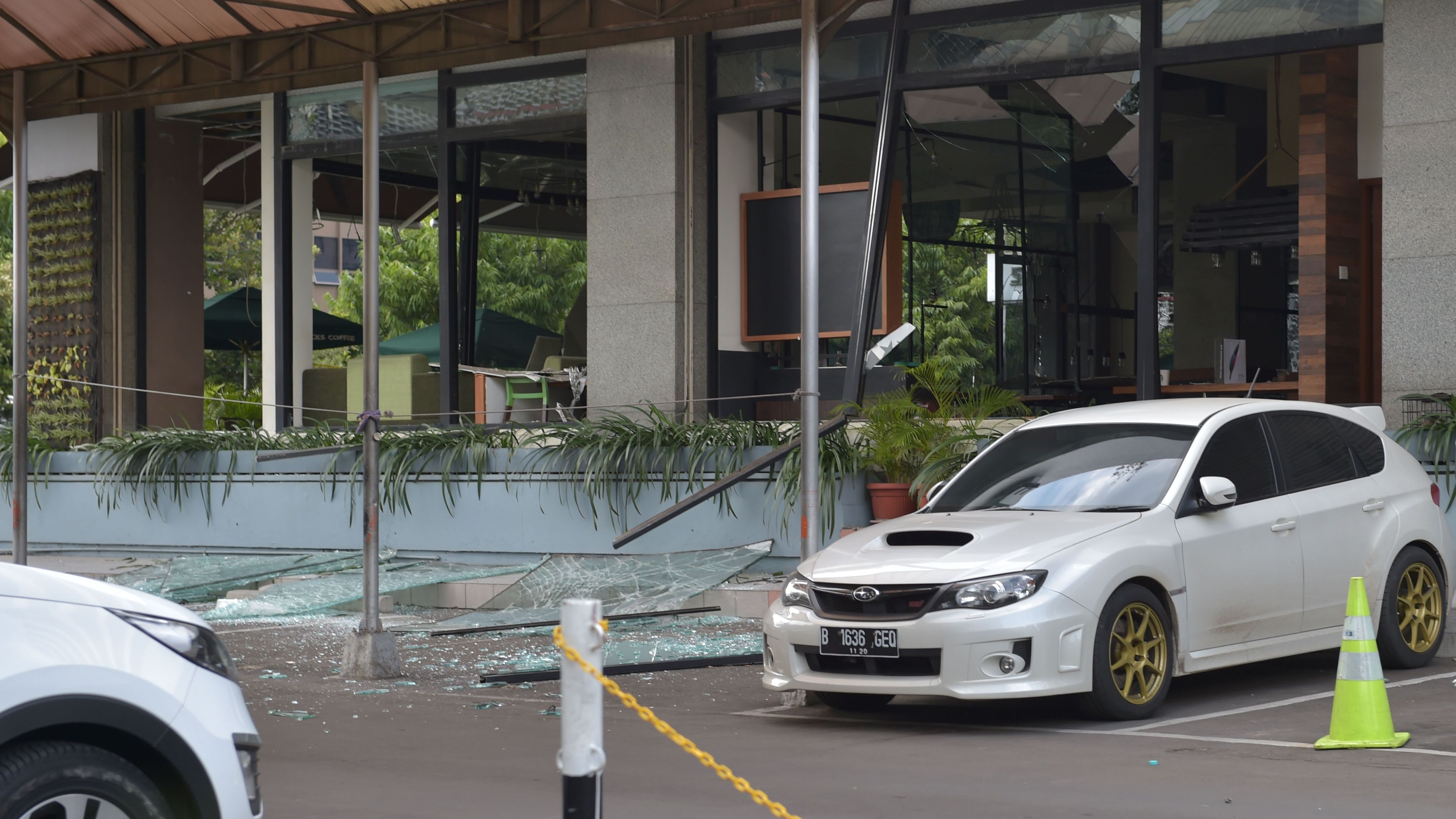 A damaged Starbucks coffee shop is seen in central Jakarta, after a series of explosions hit a popular shopping area Thursday. (AFP/Getty Images)