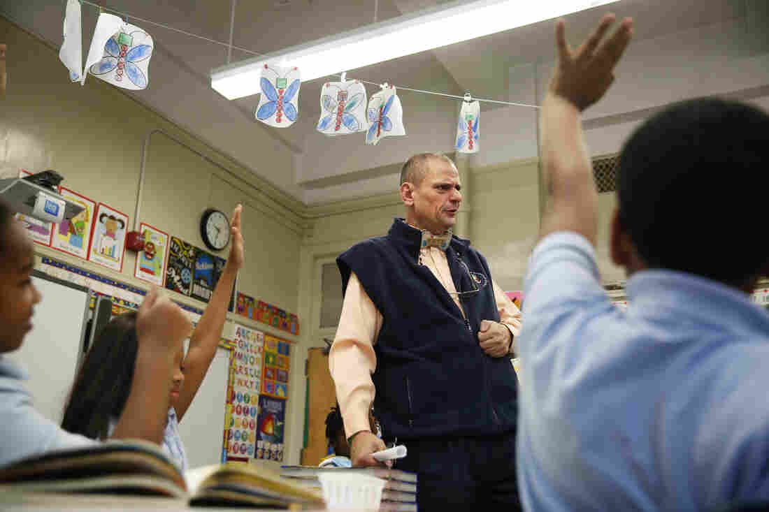 At CS55, Ritz helps other teachers, too. He pops into one classroom for a quick science lesson on owl pellets.