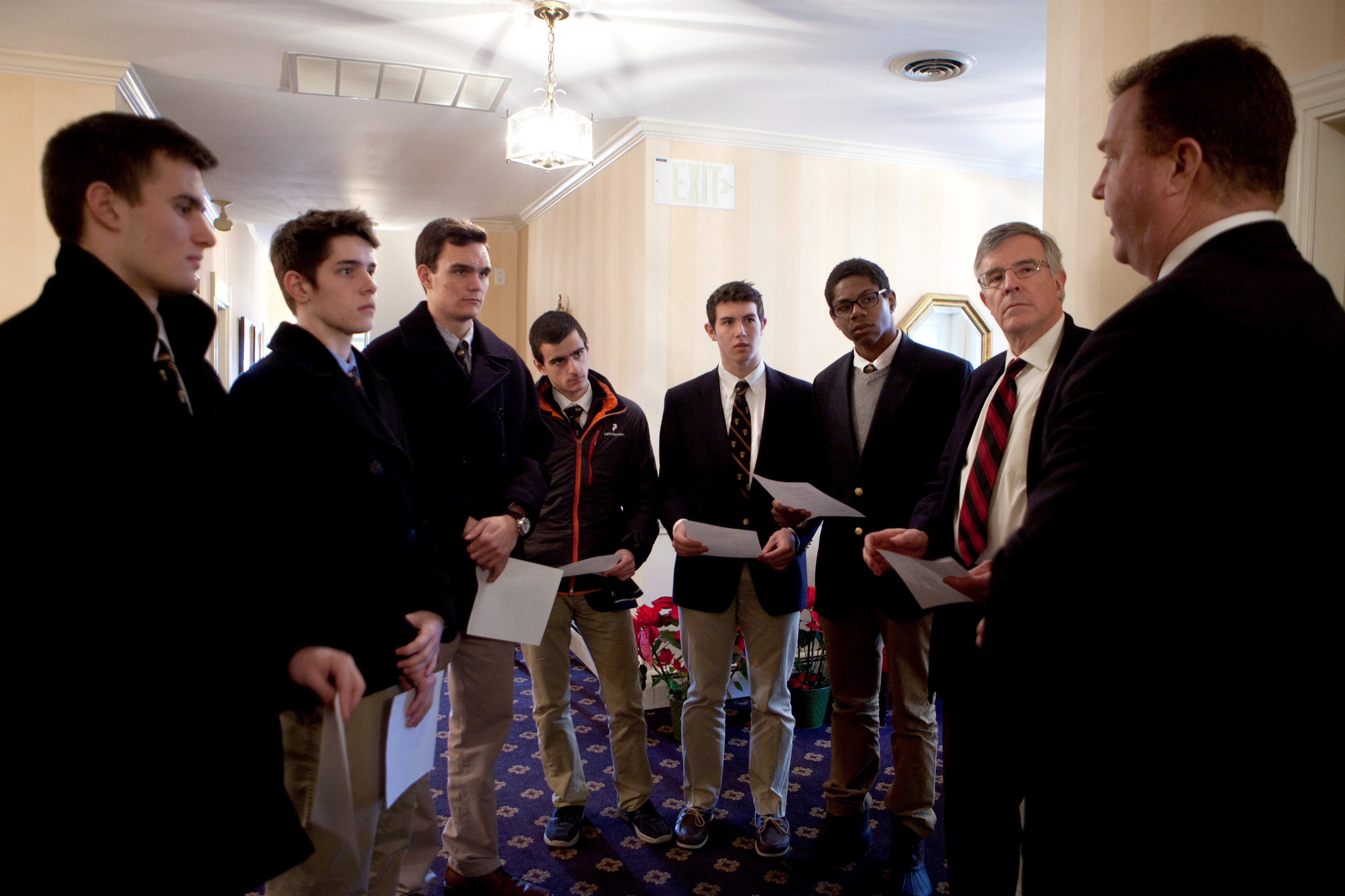 Roxbury Latin seniors Chris Rota, Liam McDonough, Emmett Dalton, Esteban Enrique, Brendan McInerney and Noah Piou, and assistant headmaster Mike Pojman, listen as funeral director Bob Lawler explains the circumstances of the death of Nicholas Mlller, whose body was unclaimed, at the Robert J. Lawler & Crosby Funeral Home.