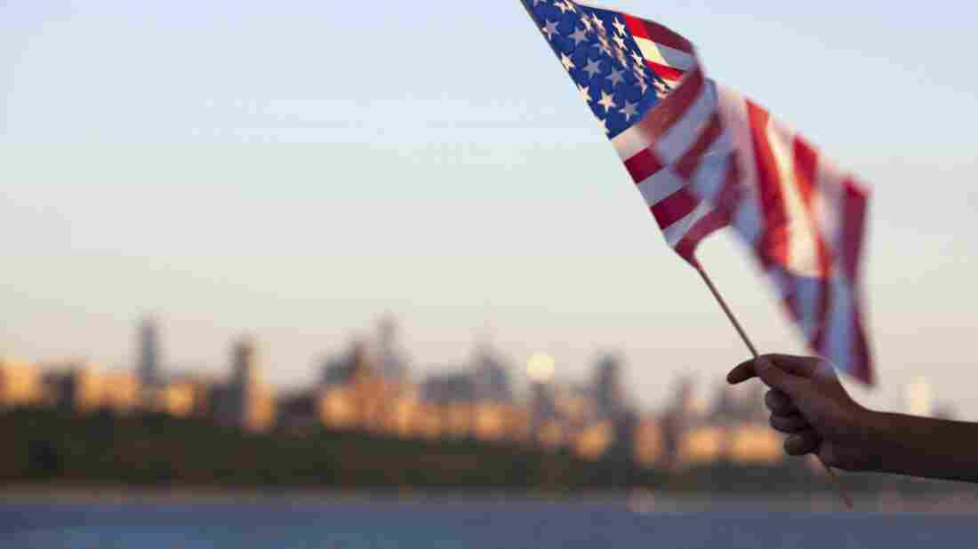 An American flag flown in front of the Hudson River in New York.