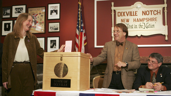 In Dixville Notch, N.H., in 2008, Tom Tillotson (center) watches as Donna Kaye Erwin casts the first ballot for the nation's first primary. That year, the tiny town picked Barack Obama over Hillary Clinton, 7-2; but Clinton went on to win the state primary.