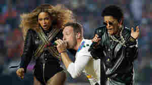 Beyoncé, Coldplay singer Chris Martin and Bruno Mars perform during halftime of the NFL Super Bowl 50 football game Sunday, Feb. 7, 2016, in Santa Clara, Calif.