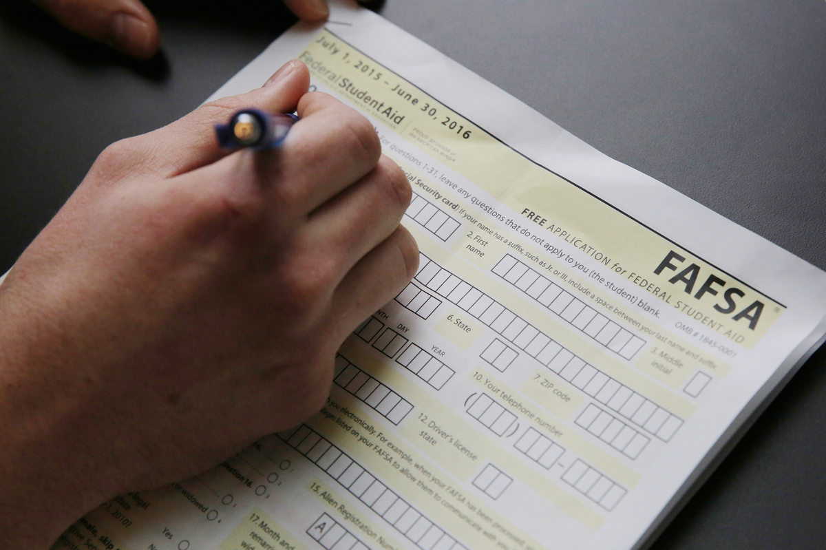High school students fill out financial aid forms and are able to submit them as early as October. (NPR)