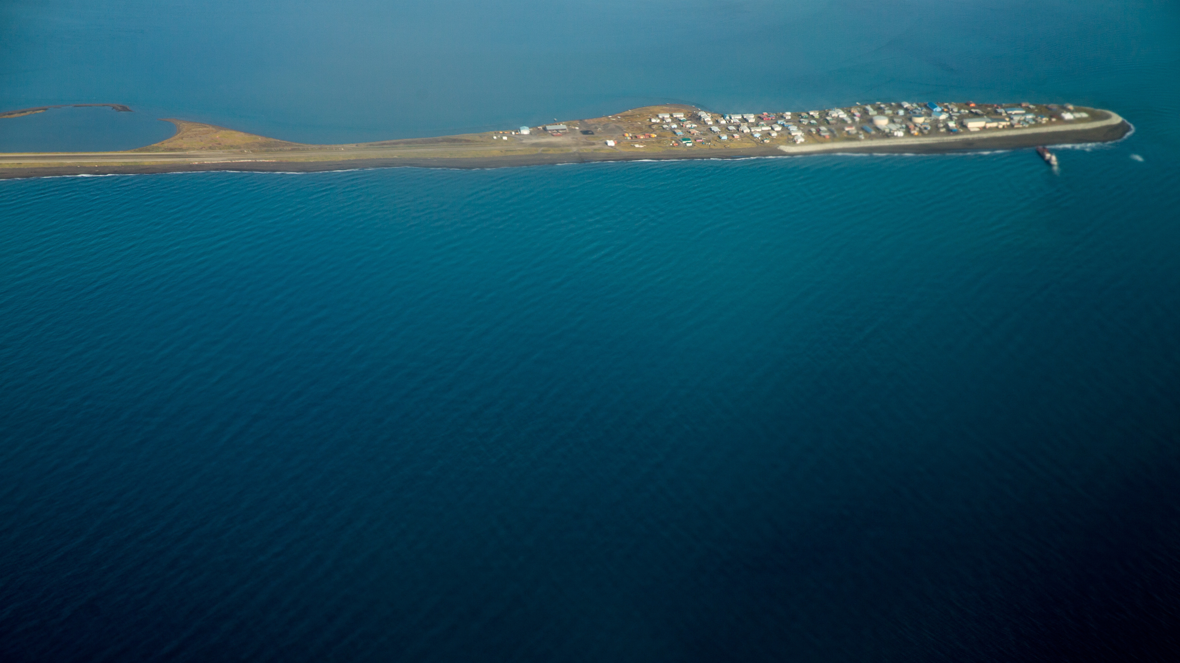 This aerial photo shows the island village of Kivalina, Alaska, a community of 400 people that is already receding into the ocean as a result of rising sea levels.