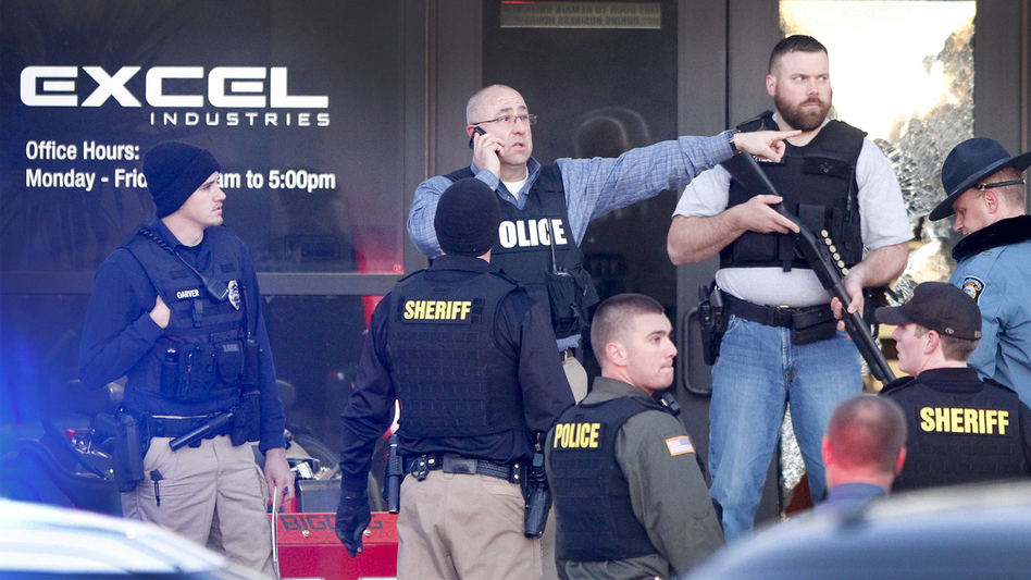 Police guard the front door of Excel Industries in Hesston, Kan., where a gunman reportedly killed three people before being shot to death by a police officer. (Fernando Salazar/Wichita Eagle/TNS via Getty Images)