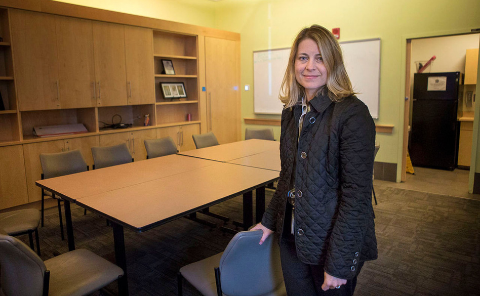 Dr. Jessie Gaeta, chief medical officer of Health Care for the Homeless at Boston Medical Center, stands in a conference room that will soon be converted to a place where patients high on heroin or other drugs can be safely monitored. (Jesse Costa/WBUR)