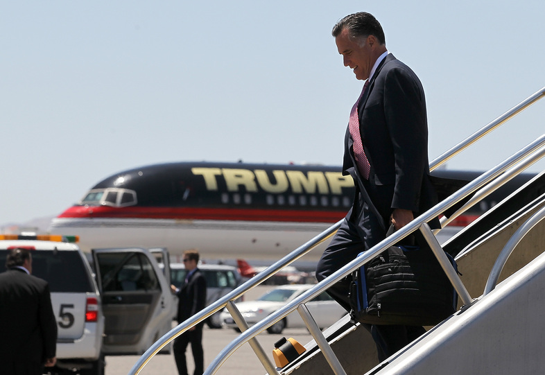 Former Republican presidential candidate Mitt Romney walks off his campaign plane past Donald Trump's plane in Las Vegas in 2012. (Justin Sullivan/Getty Images)