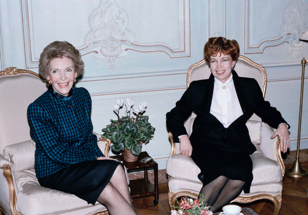 Nancy Reagan, left, and the Soviet First Lady, Raisa Gorbachev, both smile politely during a tension-filled tea in Geneva in 1985, while their husbands discussed nuclear disarmament.