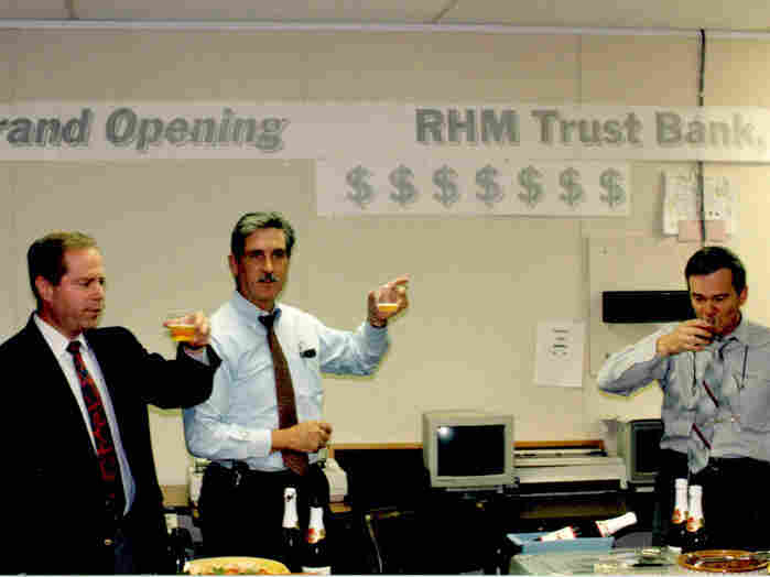 Special agents celebrate their fake offshore bank with apple juice.