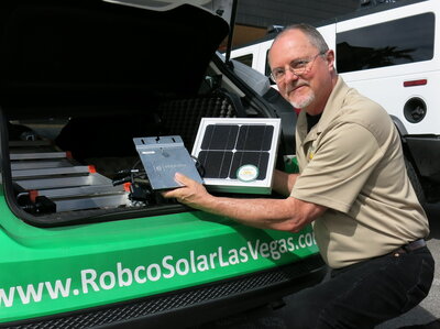 Robco Electric Sales and Marketing Manager Tim Webb shows off a solar panel from his sales kit. Since regulators have phased out solar incentives, his car often sits in the company parking lot. Robco Electric Sales and Marketing Manager Tim Webb shows off a solar panel from his sales kit. Since regulators have phased out solar incentives, his car often sits in the company parking lot.