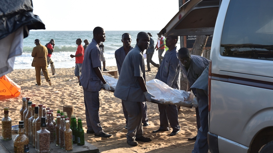 Employees load a body into a van after heavily-armed gunmen opened fire in the Ivory Coast resort town of Grand-Bassam, leaving bodies strewn on the beach, killing more than a dozen people. The assailants, who were "heavily armed and wearing balaclavas, fired at guests at the L'Etoile du Sud, a large hotel which was full of expats in the current heatwave," a witness told AFP. (Sia Kambou/AFP/Getty Images)