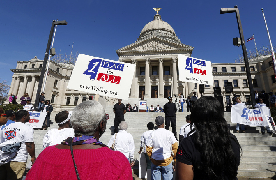Hundreds of people participate in a rally to remove the Confederate battle emblem from the Mississippi flag outside the state Capitol in Jackson, Miss., on Feb. 18, a month after flag supporters gathered there for their own event. (Rogelio V. Solis/AP)