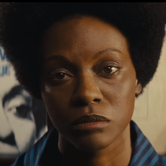 This still is from the first trailer for Nina, starring Zoe Saldana as singer Nina Simone. This image of Saldana in dark makeup and with a prosthetic nose helped reignite a controversy over skin color and casting.