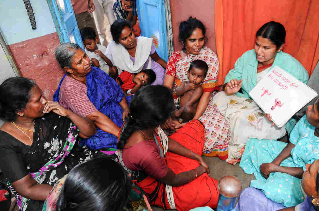 Women in Lucknow, India, learn how an IUD is inserted. A new device, allowing for easy and safe insertion after childbirth, is being tested.
