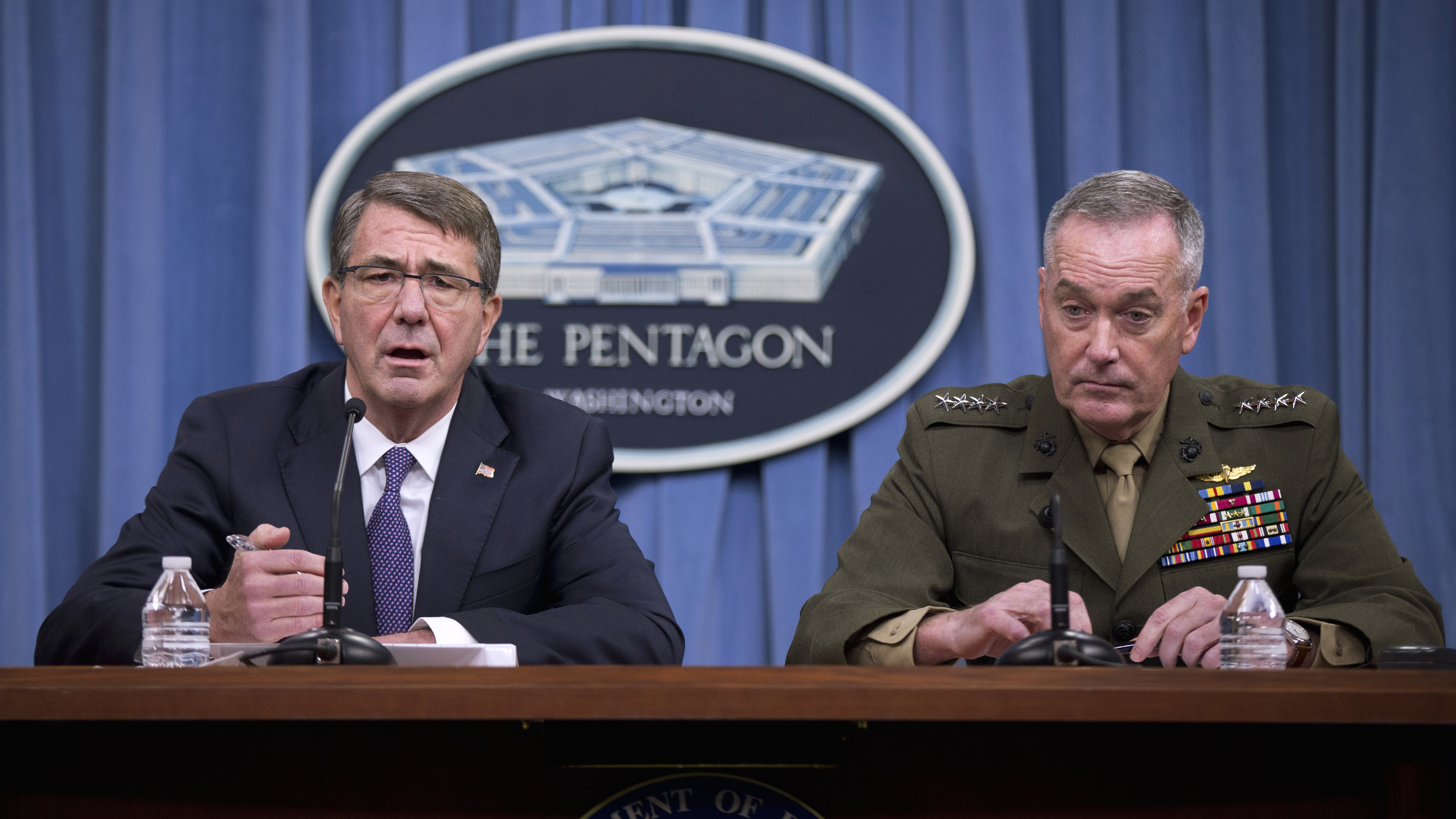 Defense Secretary Ash Carter, accompanied by Joint Chiefs Chairman Gen. Joseph Dunford, speaks during a news conference at the Pentagon on Friday.