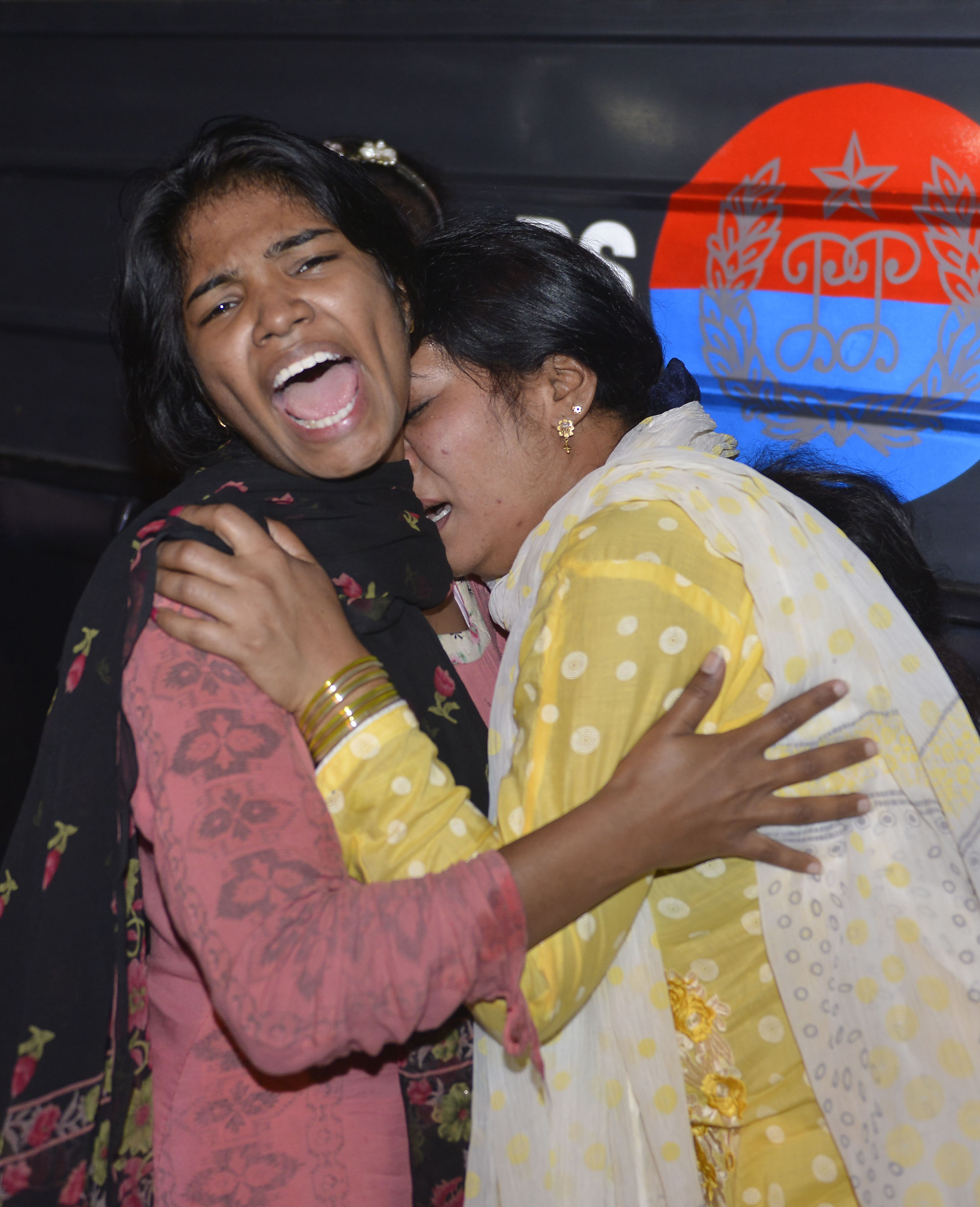 Women mourn the death of relatives after a bomb blast in Lahore, Pakistan, on Sunday.