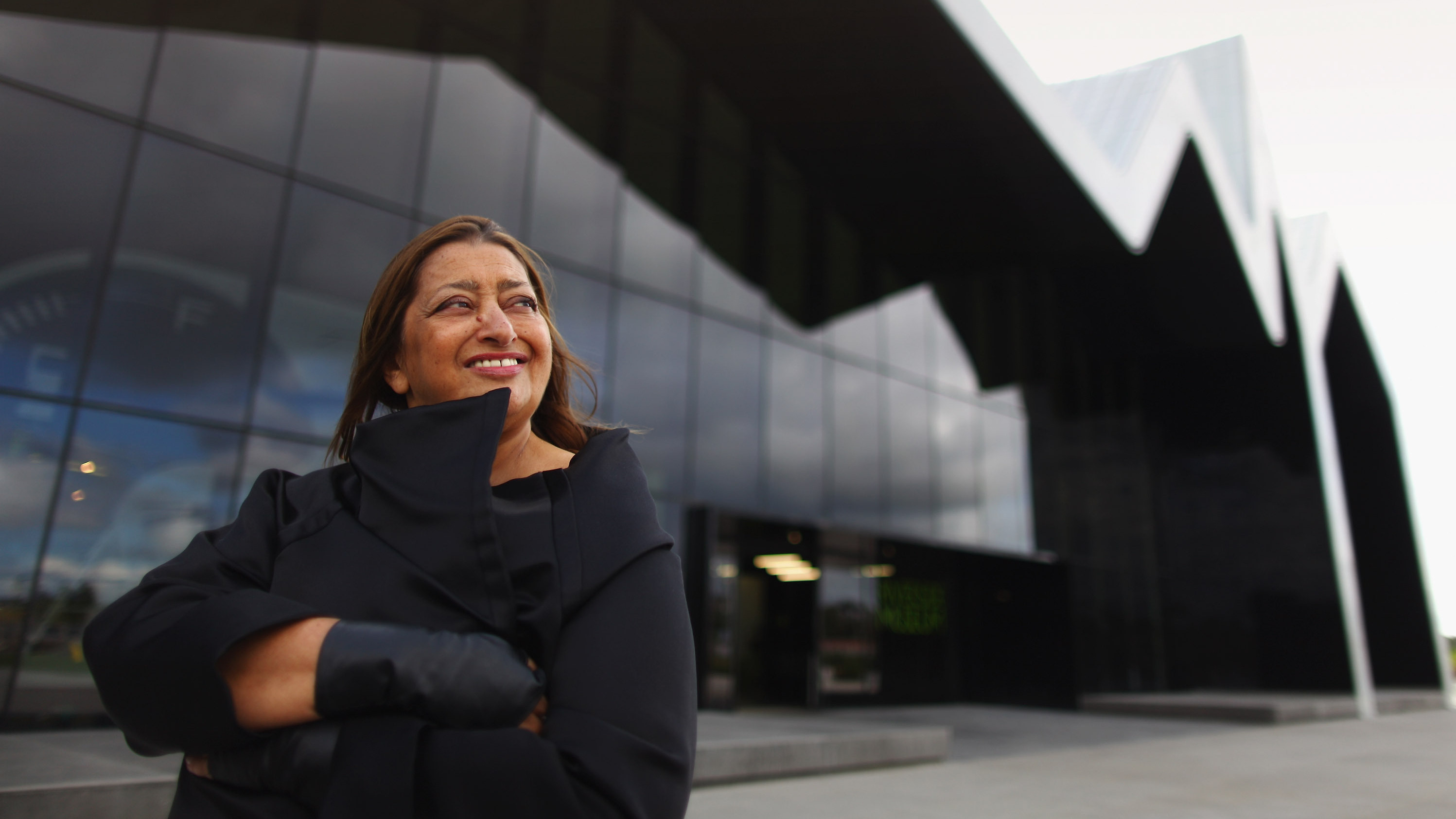 Zaha Hadid stands before the Riverside Museum, her first major public commission in the U.K., in Glasgow, Scotland, in 2011. (Getty Images)