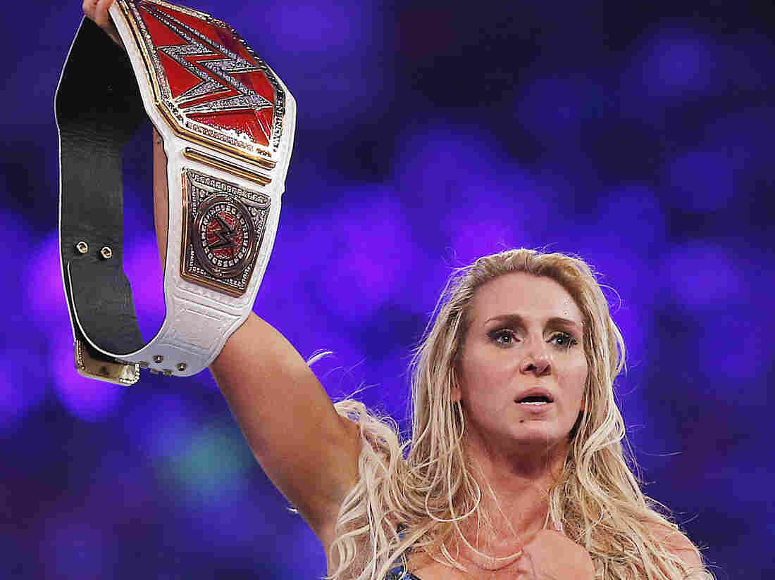 WWE women's champion Charlotte celebrates her victory at WWE WrestleMania 32 on Sunday.