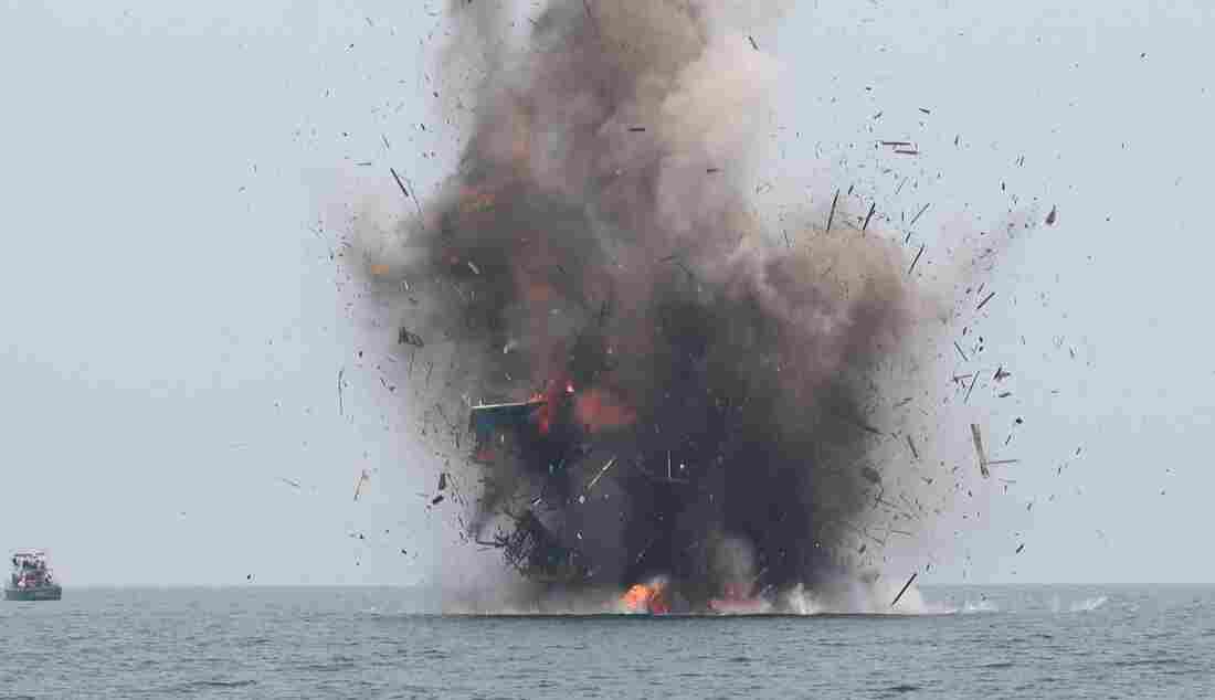 Smoke On The Water: Indonesia Blows Up Fishing Boats Of Poachers : Parallels : NPR Smoke On The Water: Indonesia Blows Up Fishing Boats Of Poachers : Parallels : NPR