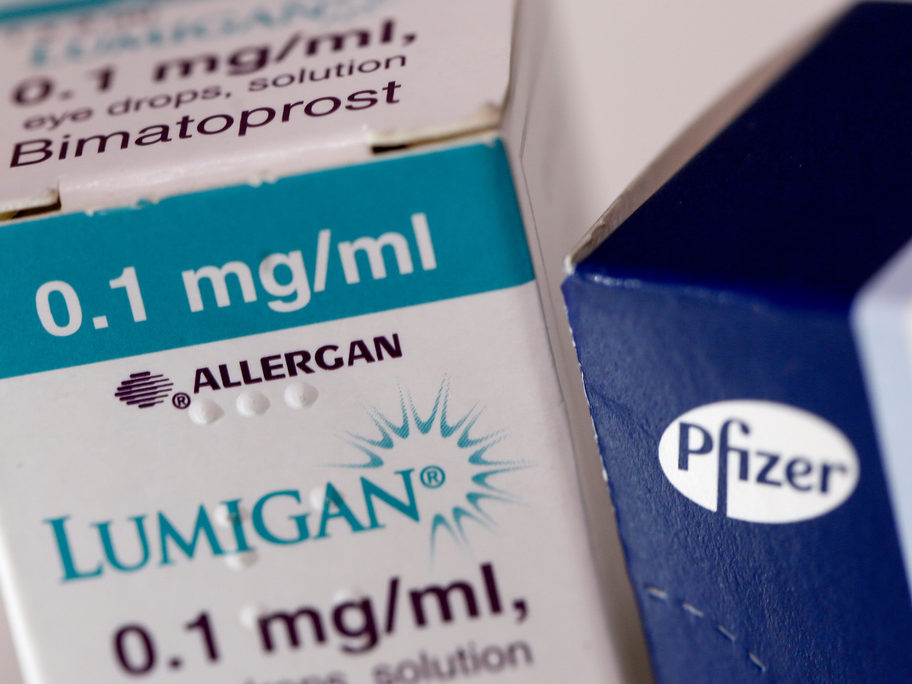A box of Lumigan eye-drops, produced by Allergan Plc, stands next to a box of Viagra tablets, produced by Pfizer Inc. The Irish and American drugmakers were planning to merge, but the deal has been called off after a change in U.S. tax law reduced the potential benefits.