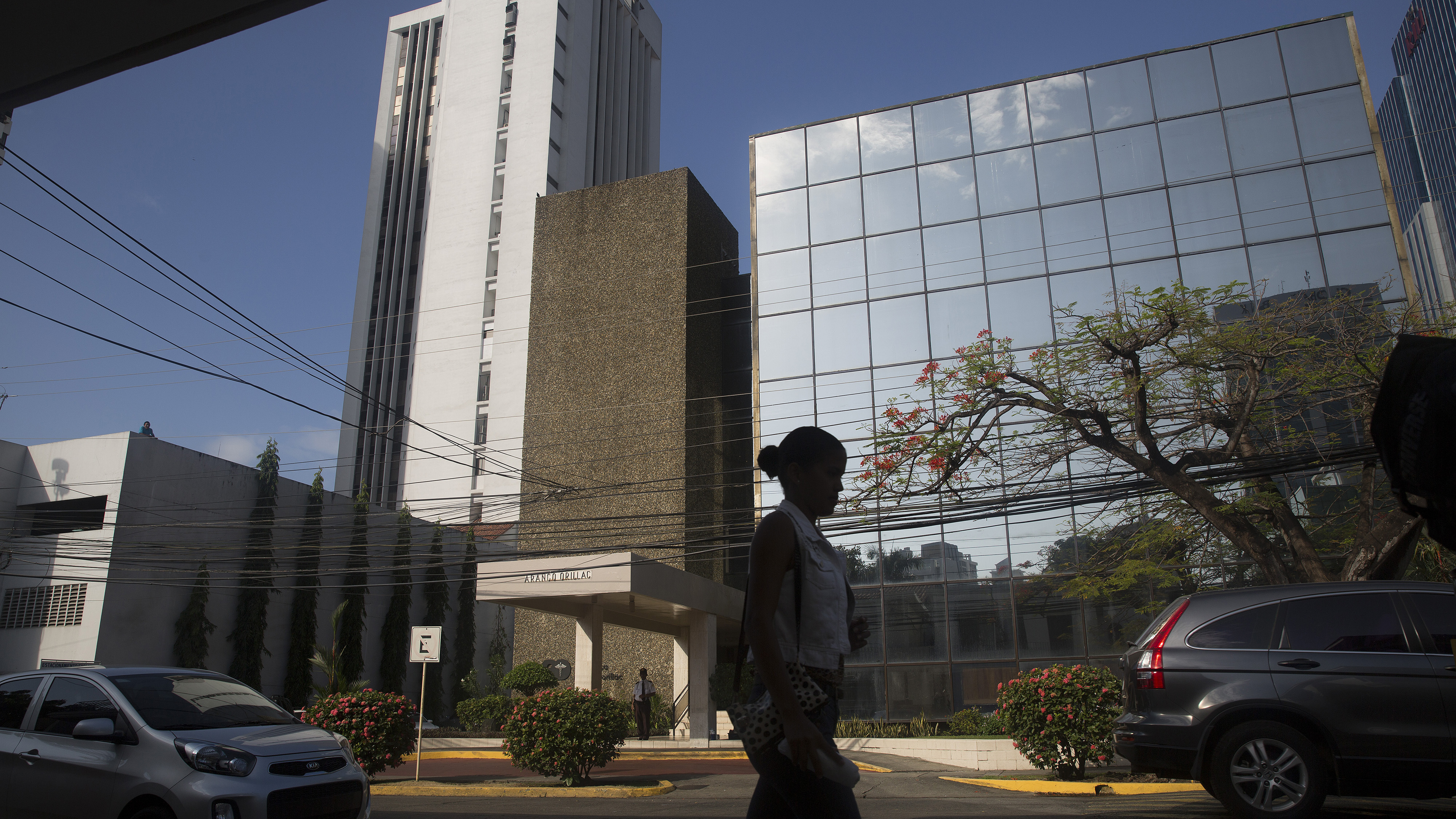 A pedestrian walks past the building housing the offices of Mossack Fonseca in Panama City, Panama, on Tuesday. The massive trove of emails, contracts and other papers from the law firm is being called the largest document leak in history. (Bloomberg via Getty Images)