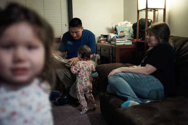 Joe Marrowbone left the reservation and moved to Sioux Falls for a job. He and his wife, Connie, play with daughters Grace and Alicia.