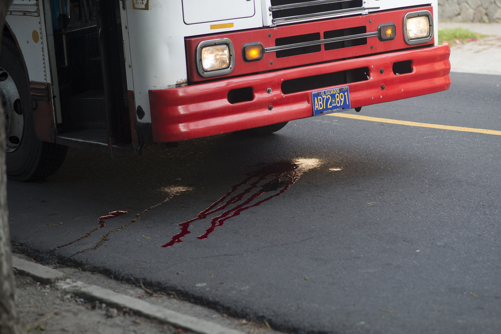 Blood at a crime scene after a bus driver was killed by suspected gang members in San Salvador.