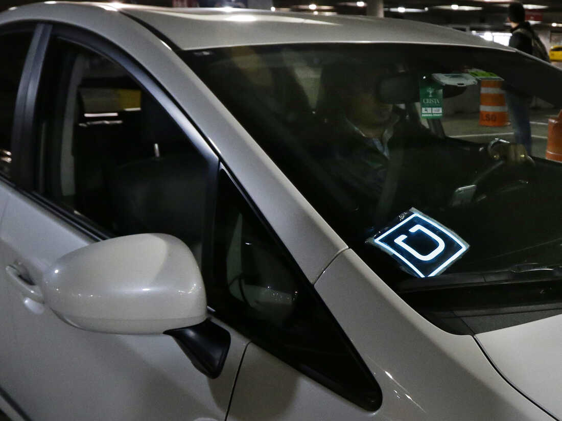 A driver for Uber arrives at an authorized customer pickup area at Seattle-Tacoma International Airport.