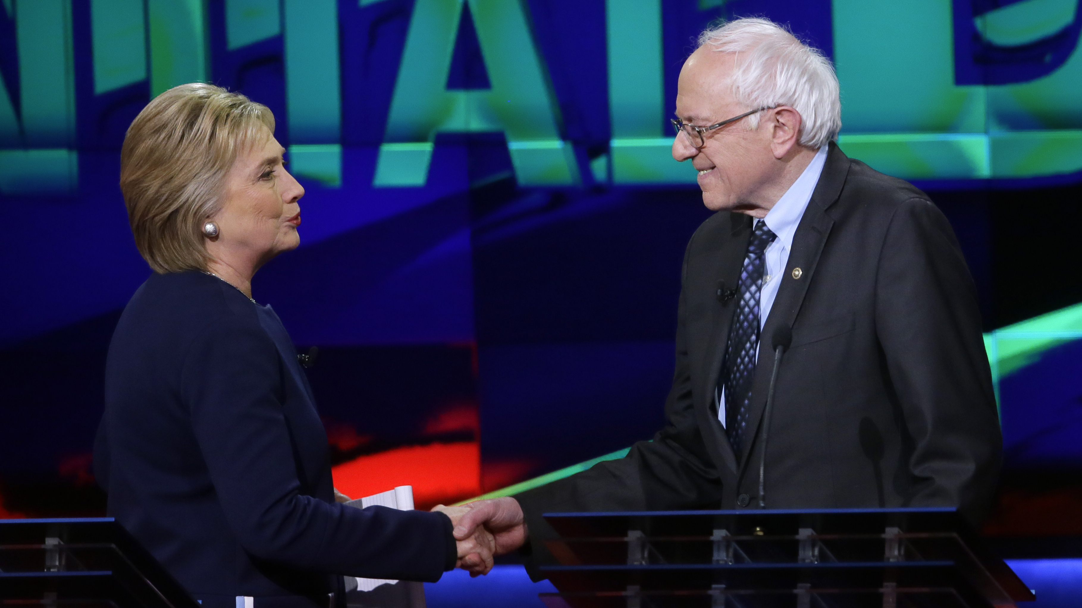 Hillary Clinton and Bernie Sanders shake hands at the end of a Democratic presidential primary debate last month.
