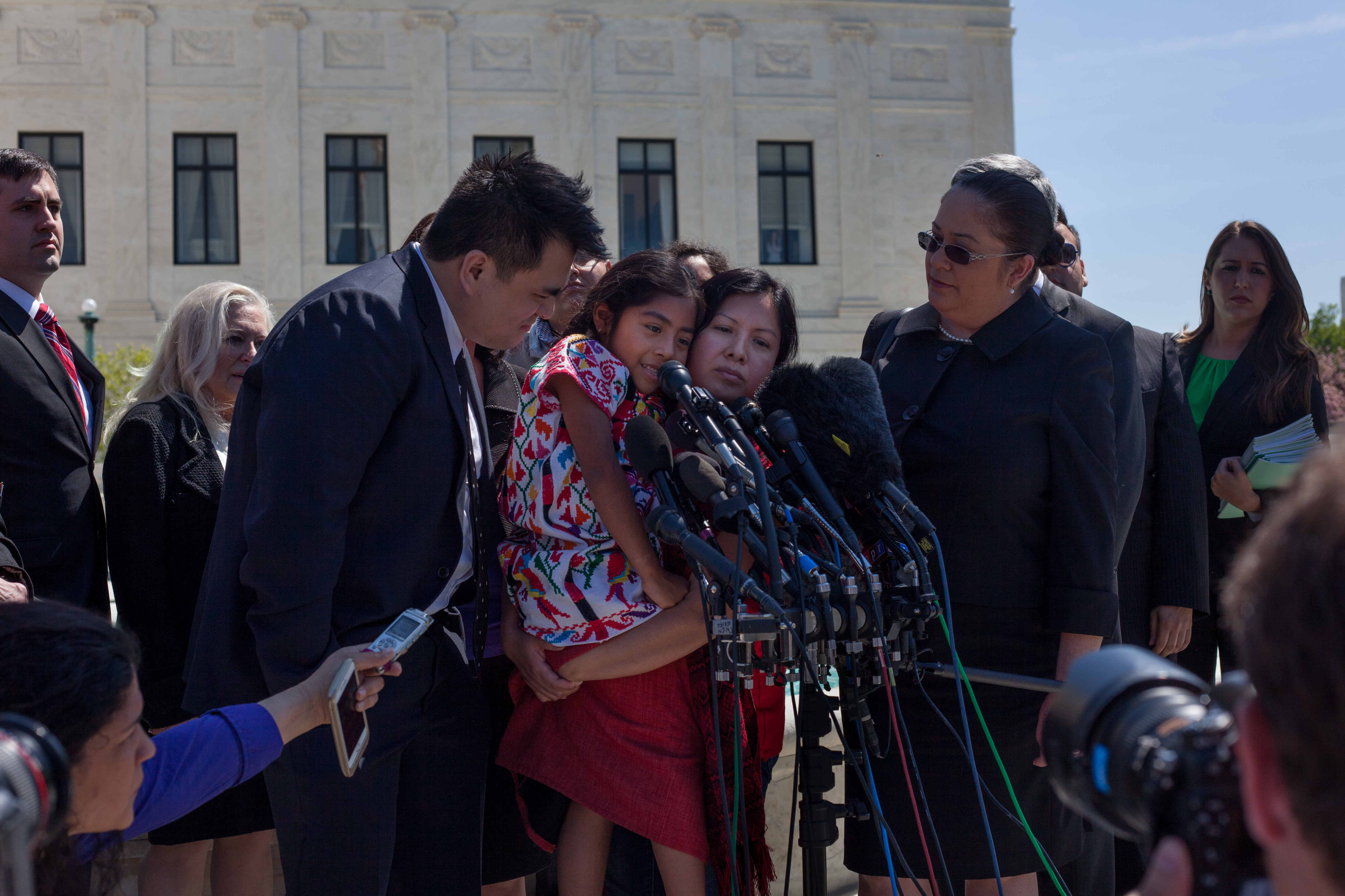 Immigrant activists, including Jose Antonio Vargas and Sophie Cruz, speak to reporters after oral arguments at the Supreme Court. (NPR)