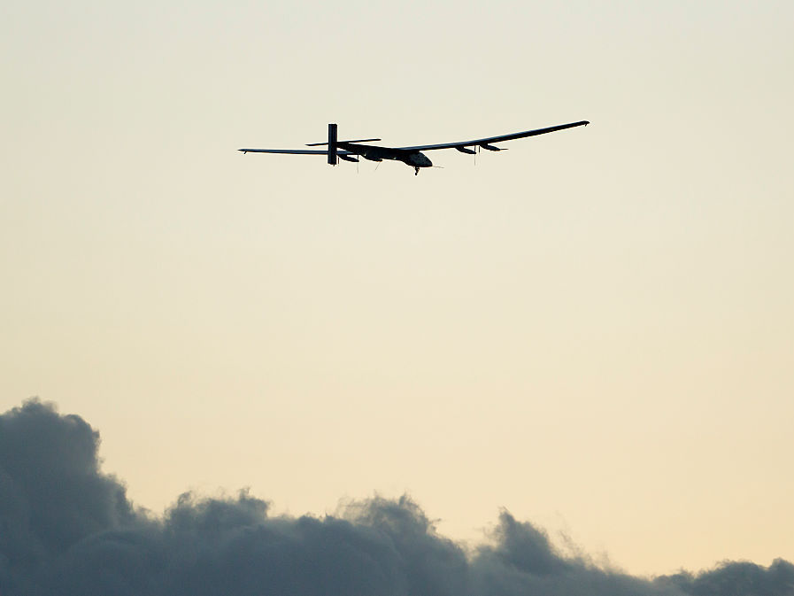 The Solar Impulse 2 airplane, piloted by Bertrand Piccard, gains altitude after taking off from Kalaeloa Airport in Kapolei, Hawaii during a test and training flight in April.