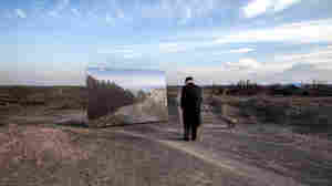 "My home," exclaims Movses Haneshyan, on seeing the enlarged image presented to him by photographer Diana Markosian. He'd fled with his father at age 5.